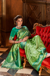 Designer contrasting Light Green exclusive woven silk saree with pure weaving silk, zari woven butta and contrast border pallu